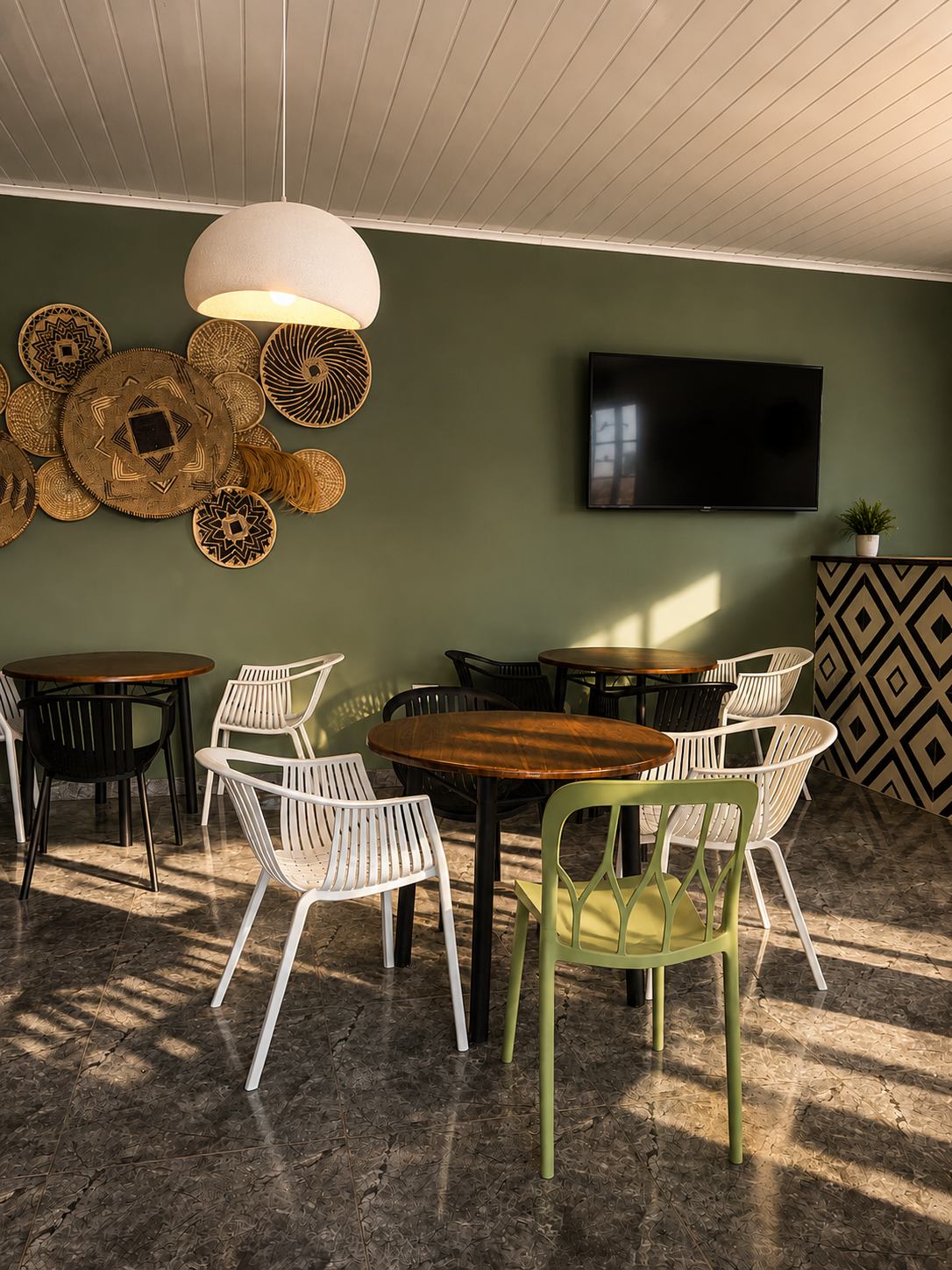 The Clay Pot interior with woven basket wall art